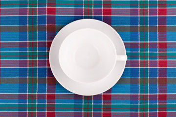 the plate on checkered table cloth