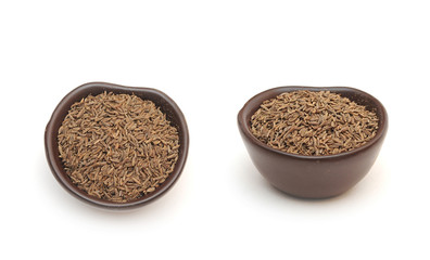 spices cumin seeds in a clay bowl