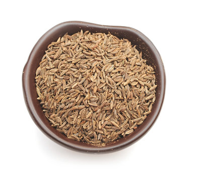 spices, cumin seeds in a clay bowl