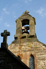 Cross and bell tower.