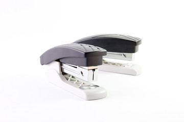 Composition of two identical office staplers