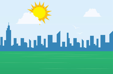 Daytime city skyline with large sun above a grassy field