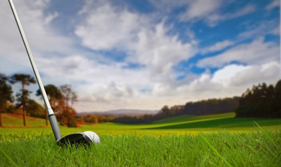 hitting golf ball on fairway