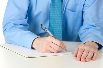 Businessman writing on document