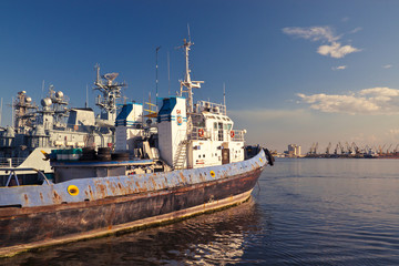 Old towboat docked in port.