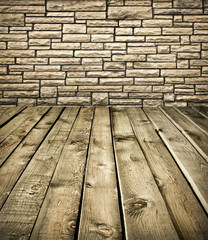 Grungy stone wall and wooden floor