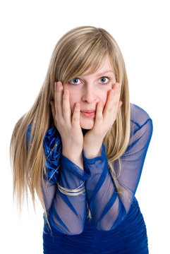 Shocked or surpised young woman with long blond hair, covering h