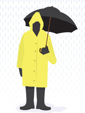 Man standing in raincoat in the rain.