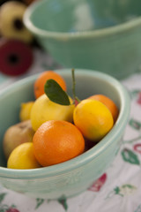 Fresh citrus fruits in a vintage ceramic bowl