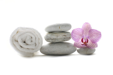 Obraz na płótnie Canvas spa stones and towel with pink orchid
