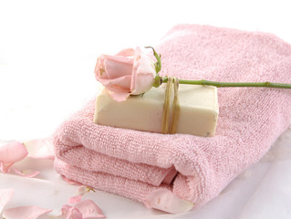 Obraz na płótnie Canvas Spa concept with towel, soap as a flower of rose