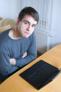 huffing man at the laptop