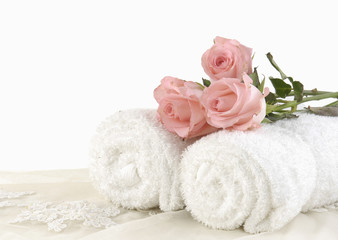 Fototapeta na wymiar White roller towel with pink roses
