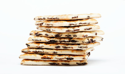 A stack of cookies with caramel filling on a white background.
