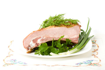 Tasty smoked meat with dill on a white background