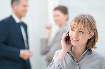 Happy young lady at phone