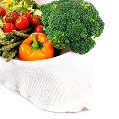 broccoli with tomatoes and green leaves isolated on white