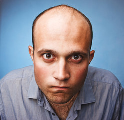 pensive young man in shirt