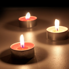 Burning candles in the dark