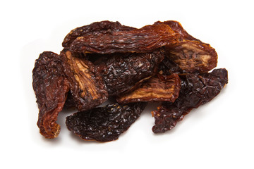 Sun dried tomato's on a white studio background.