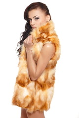 beautiful sexy nude brunette girl in fur coat