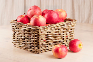 red apples in basket on the table