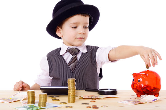 Boy at the table counts money