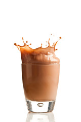 Chocolate splashing into glass