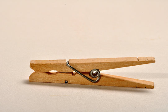 Singler wooden clothes pin.