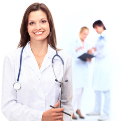 Female Doctor standing in Front of her team in the