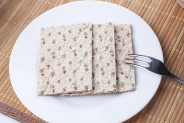 Crackers in a dish and fork