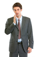 Portrait of shocked businessman