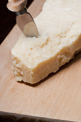 Parmesan cheese with knife
