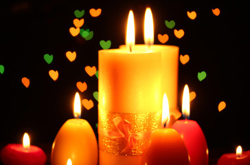 Beautiful candle and decor on wooden table on bright background