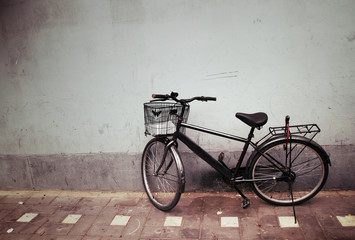 Fototapeta na wymiar Old Bicycle against a Wall
