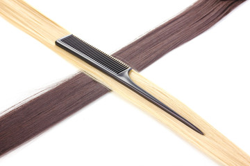 Shiny blond and brown hair with comb isolated on white