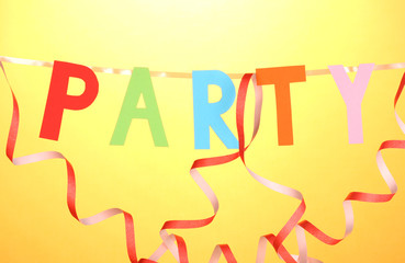 Party items close-up on orange background