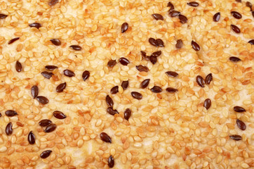 Sesame seeds on bread, close up, background