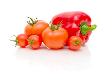 tomatoes and red peppers on a white background