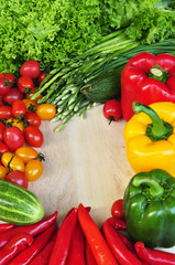 Colorful vegetables frame on wooden board