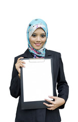 Beautiful Muslim woman holding a blank paper on file