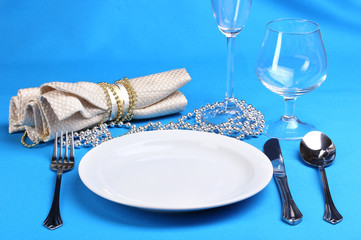 Table setting on blue background