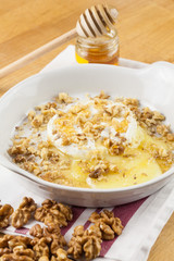 Melted cheese with honey and nuts