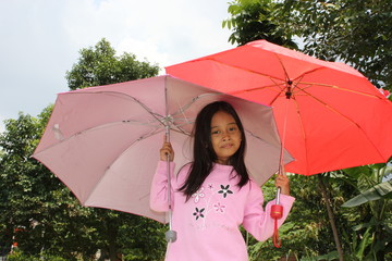 Little Girl Under Umbrellas