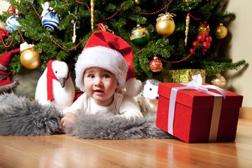 Fototapeta na wymiar Little boy in Santa Claus hat.
