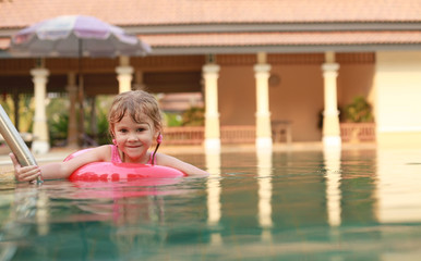 a little girl in the pool