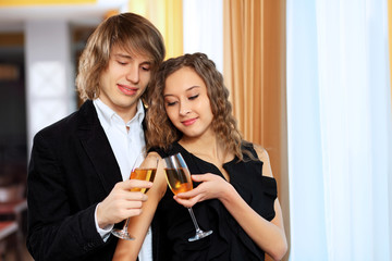 Couple in a restaurant with shampagne