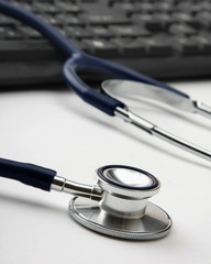 Stethoscope on computer keyboard