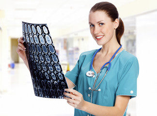 Female doctor with the MRI in hospital