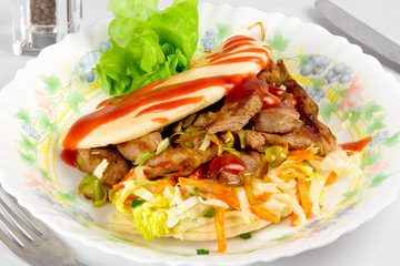 burger with meat and vegetable on plate